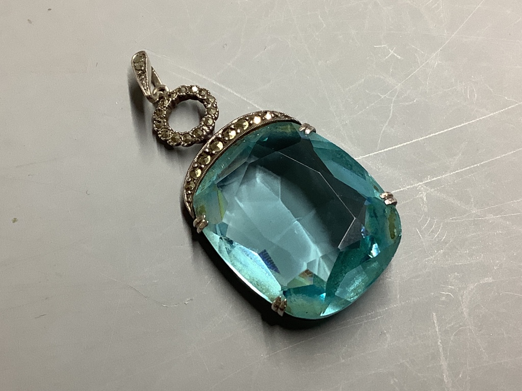 A continental white metal (stamped 935), blue paste and marcasite set pendant